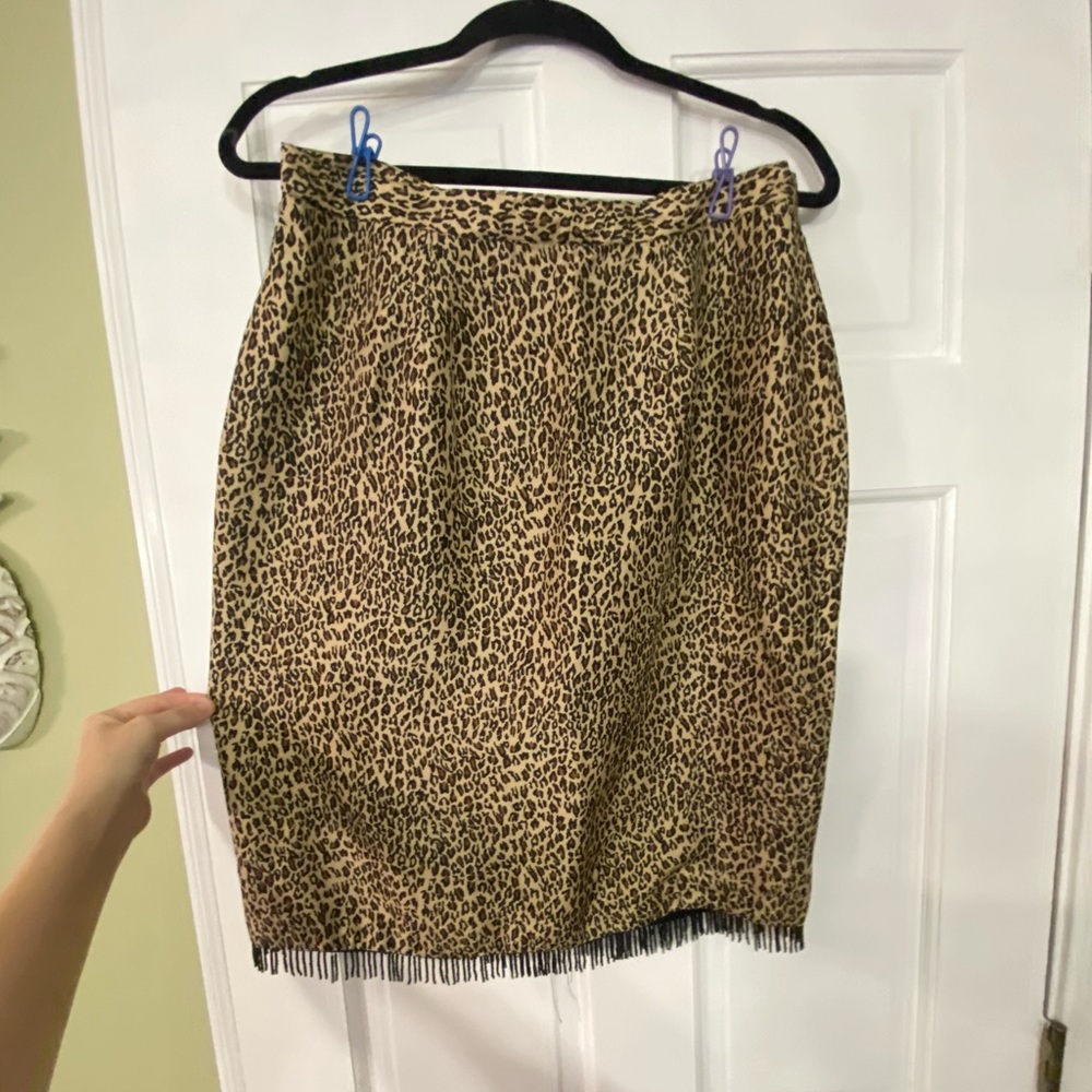 Vintage silkland animal print skirt. Beaded front adds flair.